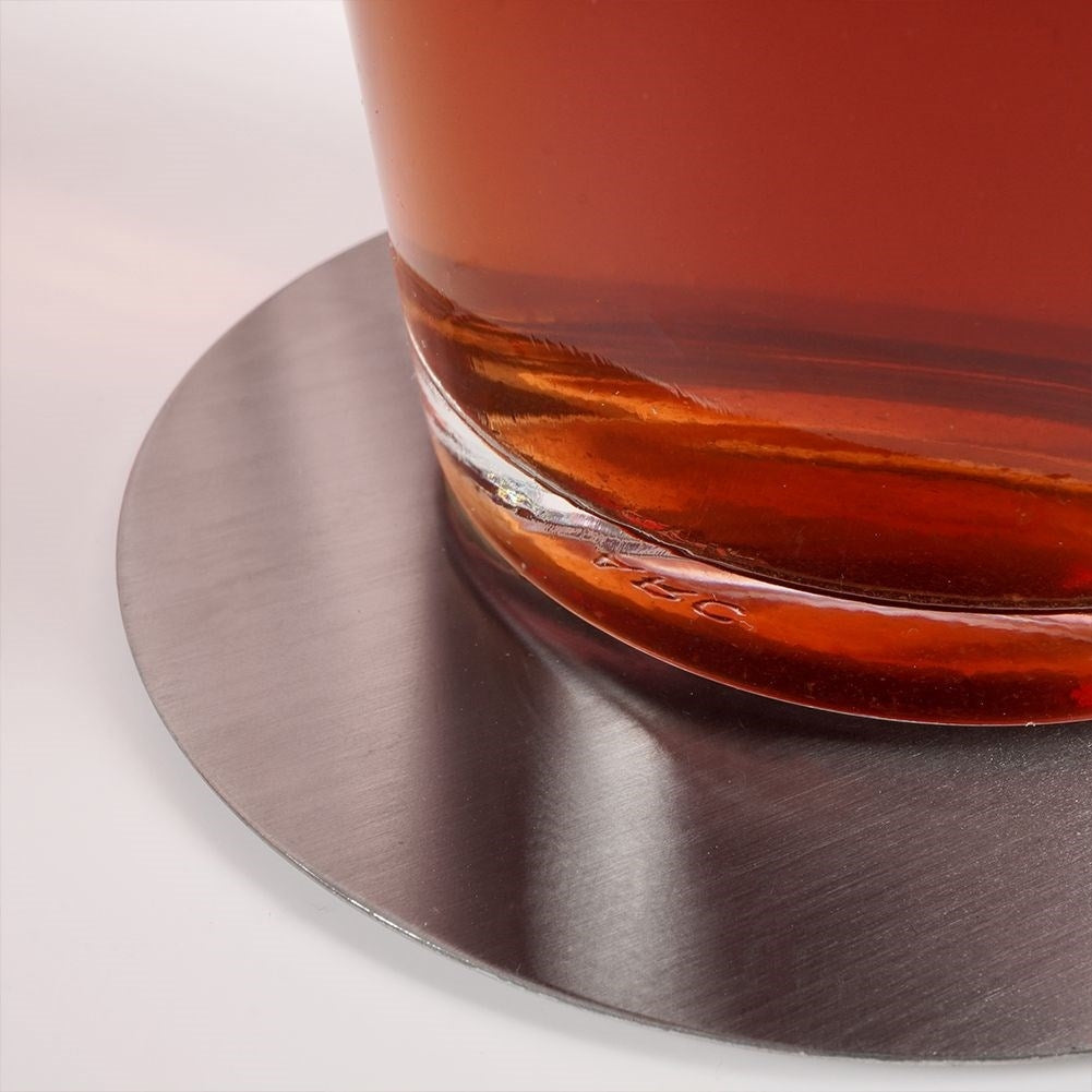 Six stainless steel coasters with protective foam