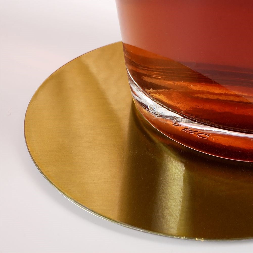 Six stylish coasters in gold-colored stainless steel with a protective layer