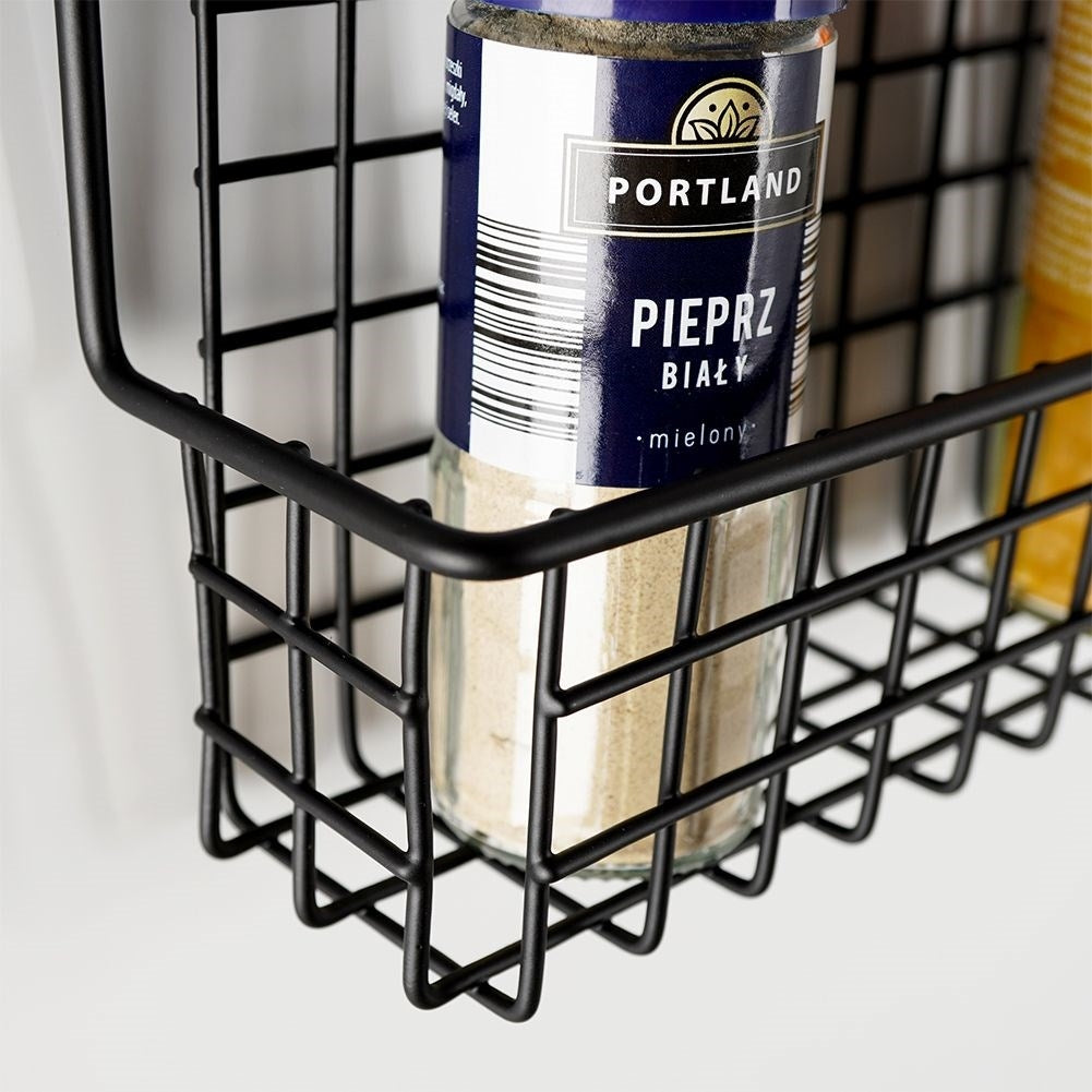 Slim wall-mounted shelf in black metal for spices and cosmetics