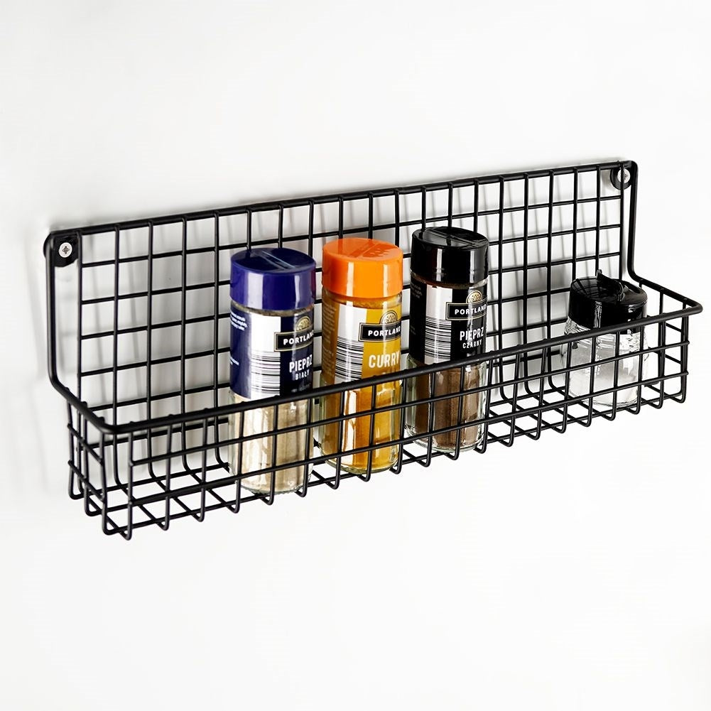 Slim wall-mounted shelf in black metal for spices and cosmetics