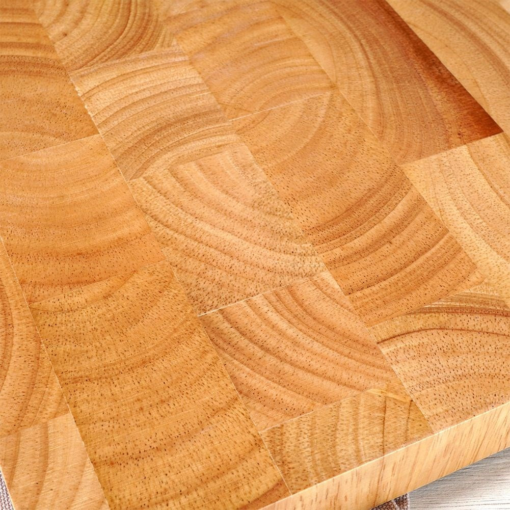 Solid wooden cutting board with recesses for easy handling