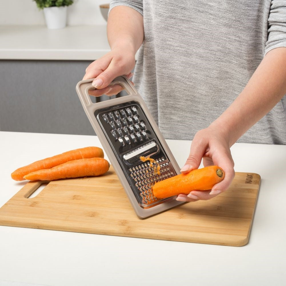 Space-saving kitchen grater with three blades for all needs