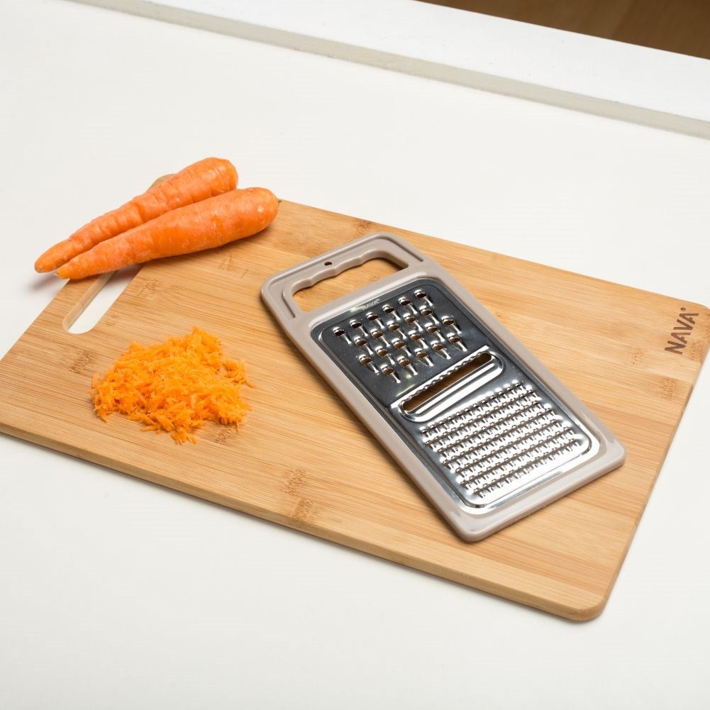 Space-saving kitchen grater with three blades for all needs