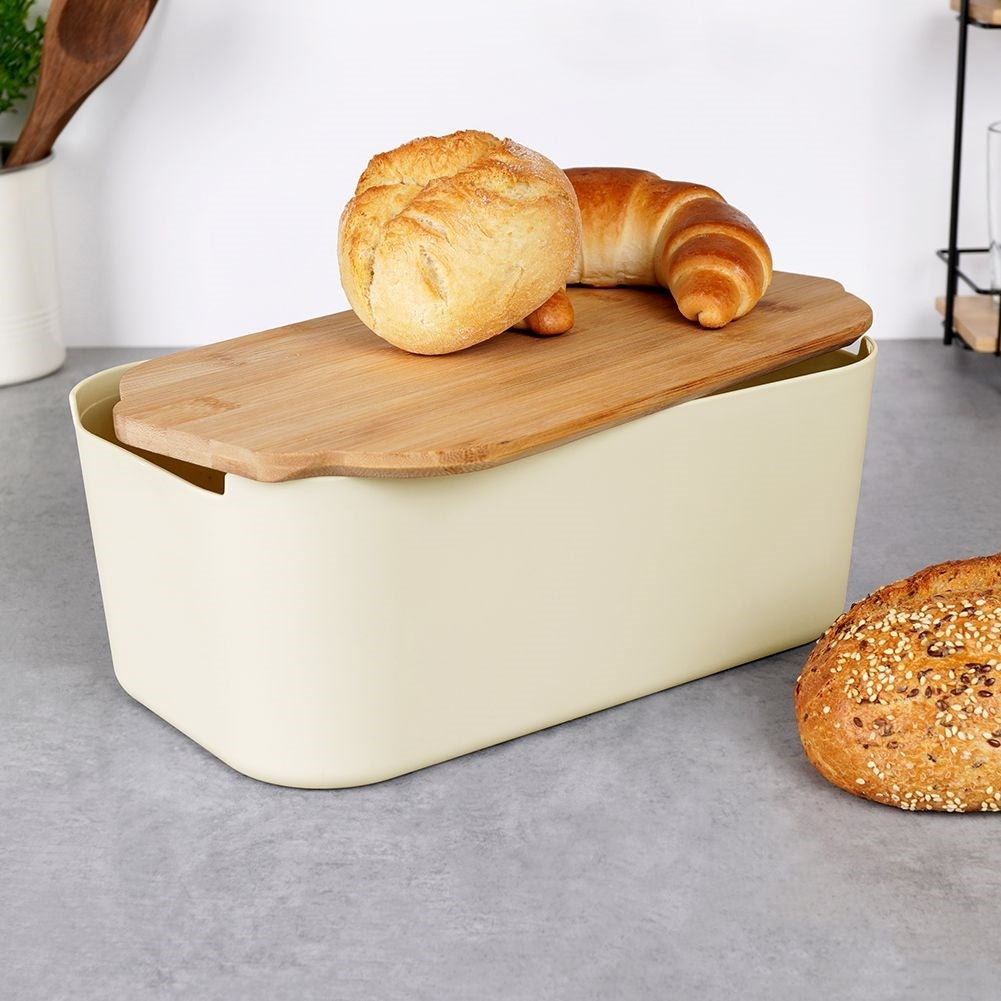 Spacious bread box in cream color with bamboo cutting board