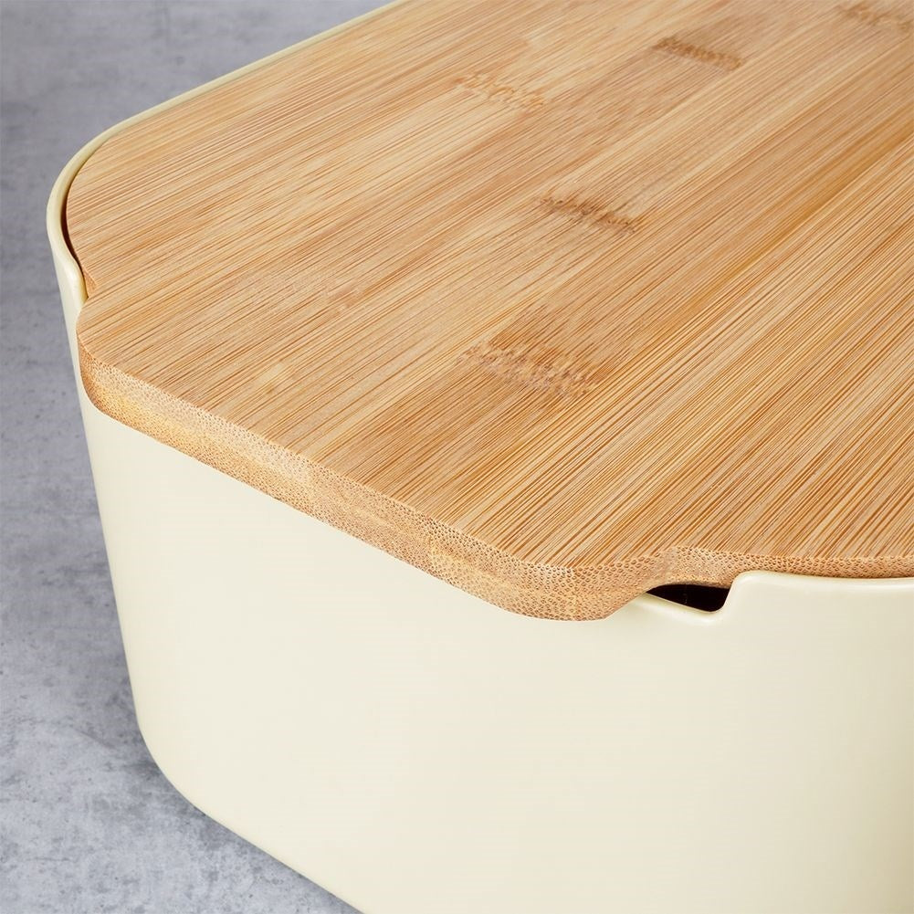 Spacious bread box in cream color with bamboo cutting board