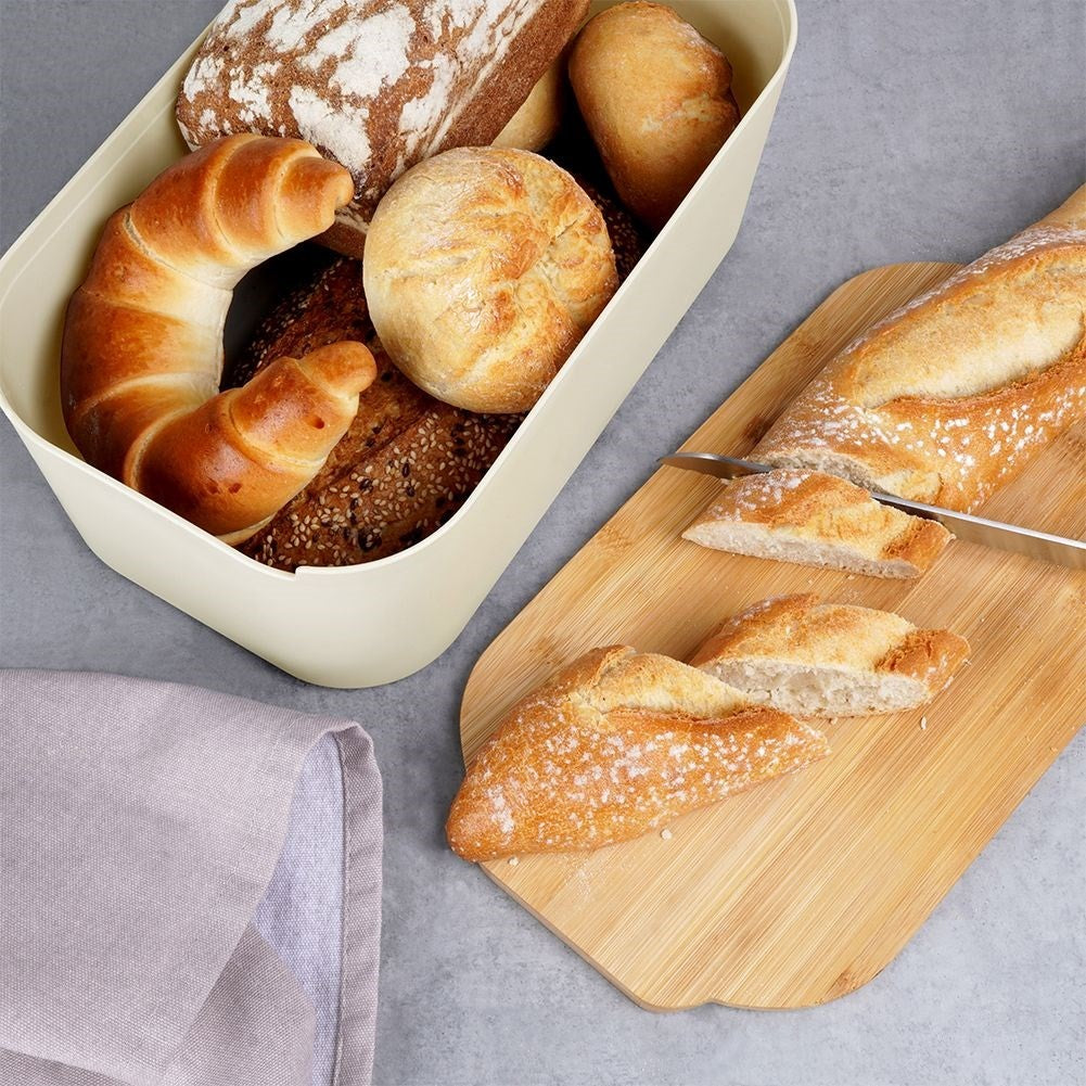 Spacious bread box in cream color with bamboo cutting board