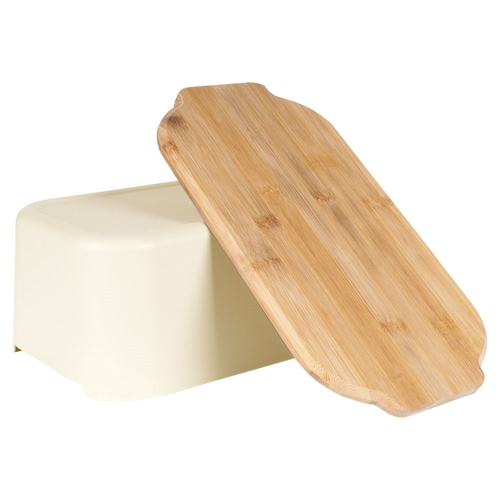 Spacious bread box in cream color with bamboo cutting board