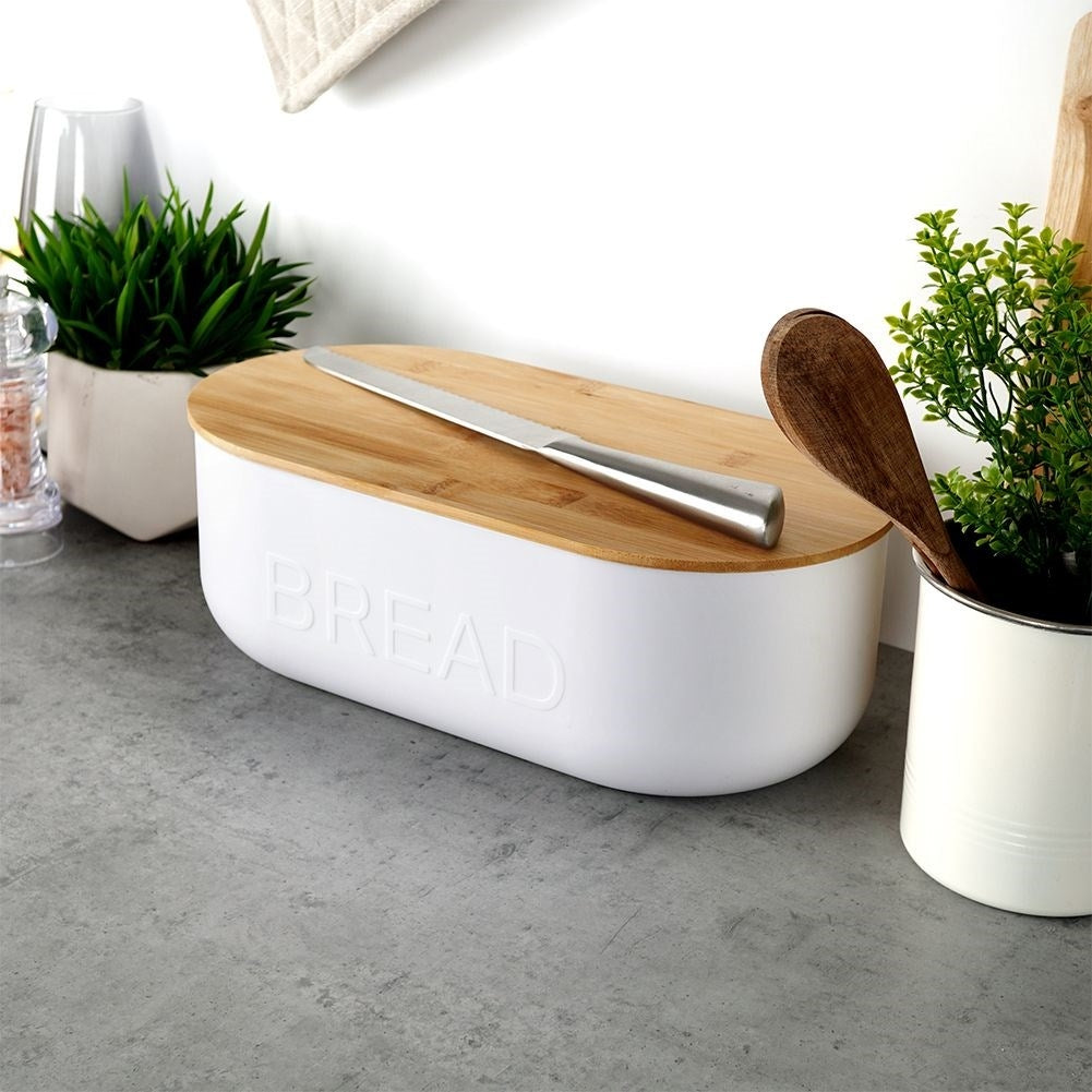 Spacious bread box in white with bamboo cutting board lid