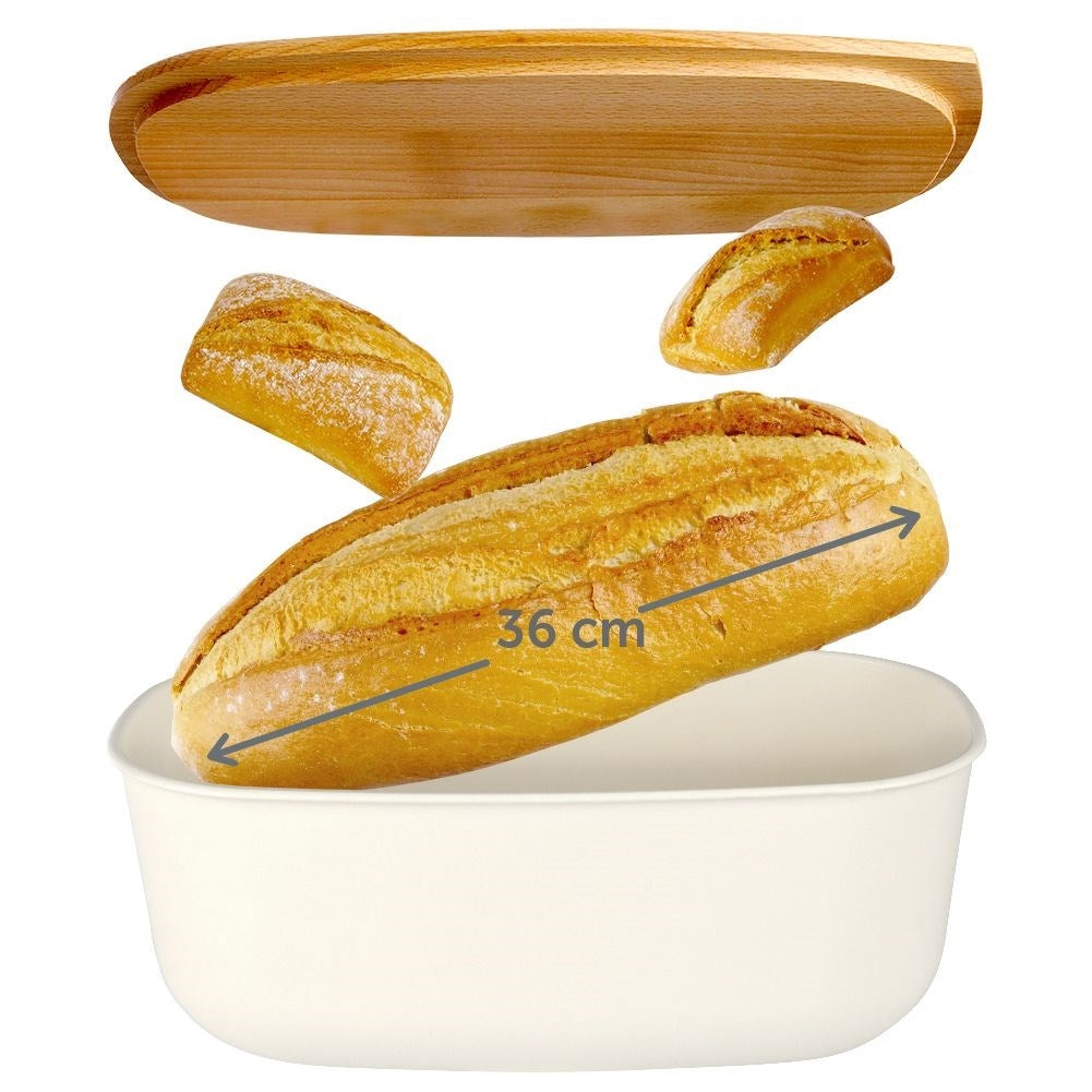 Spacious cream colored bread box with wooden cutting board