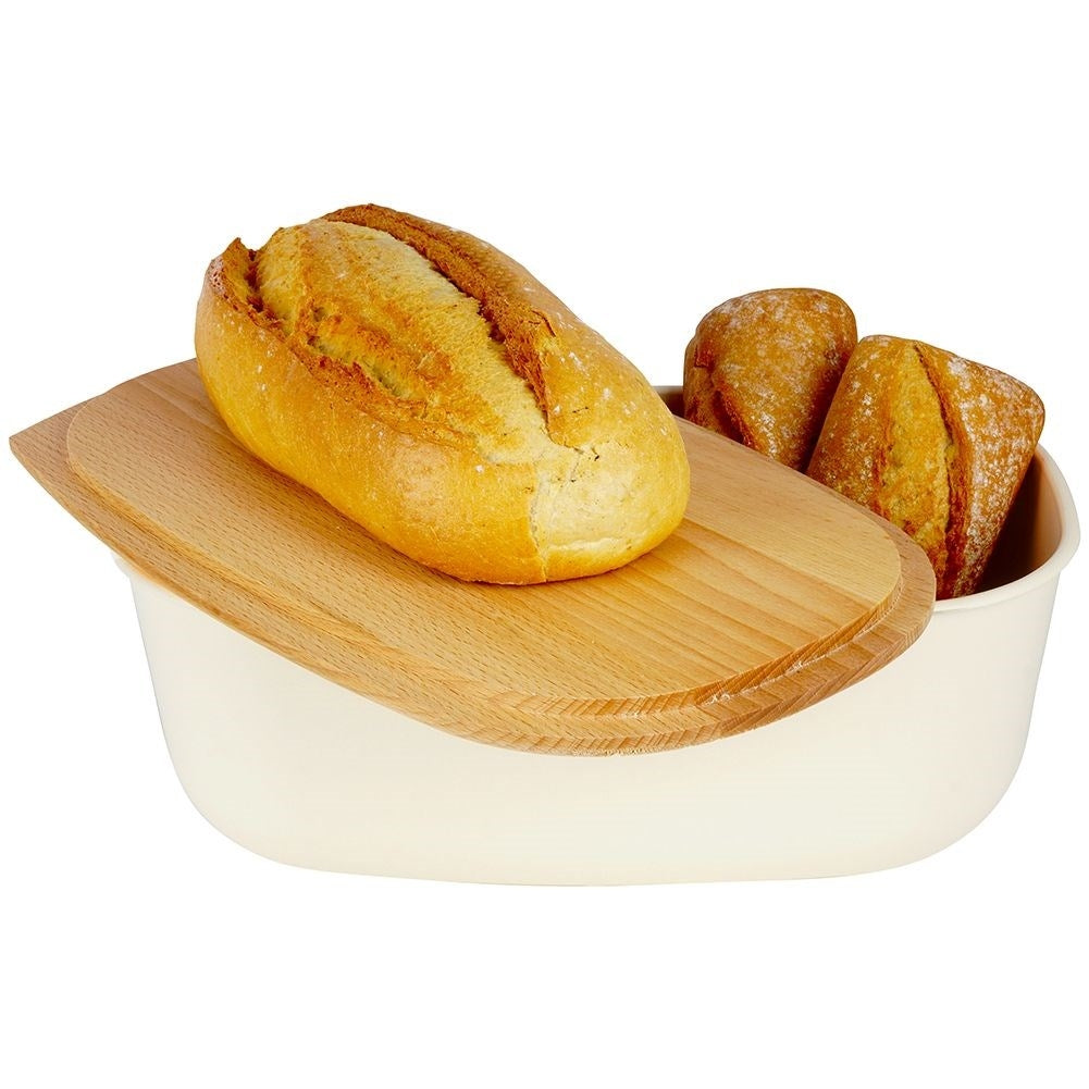 Spacious cream colored bread box with wooden cutting board