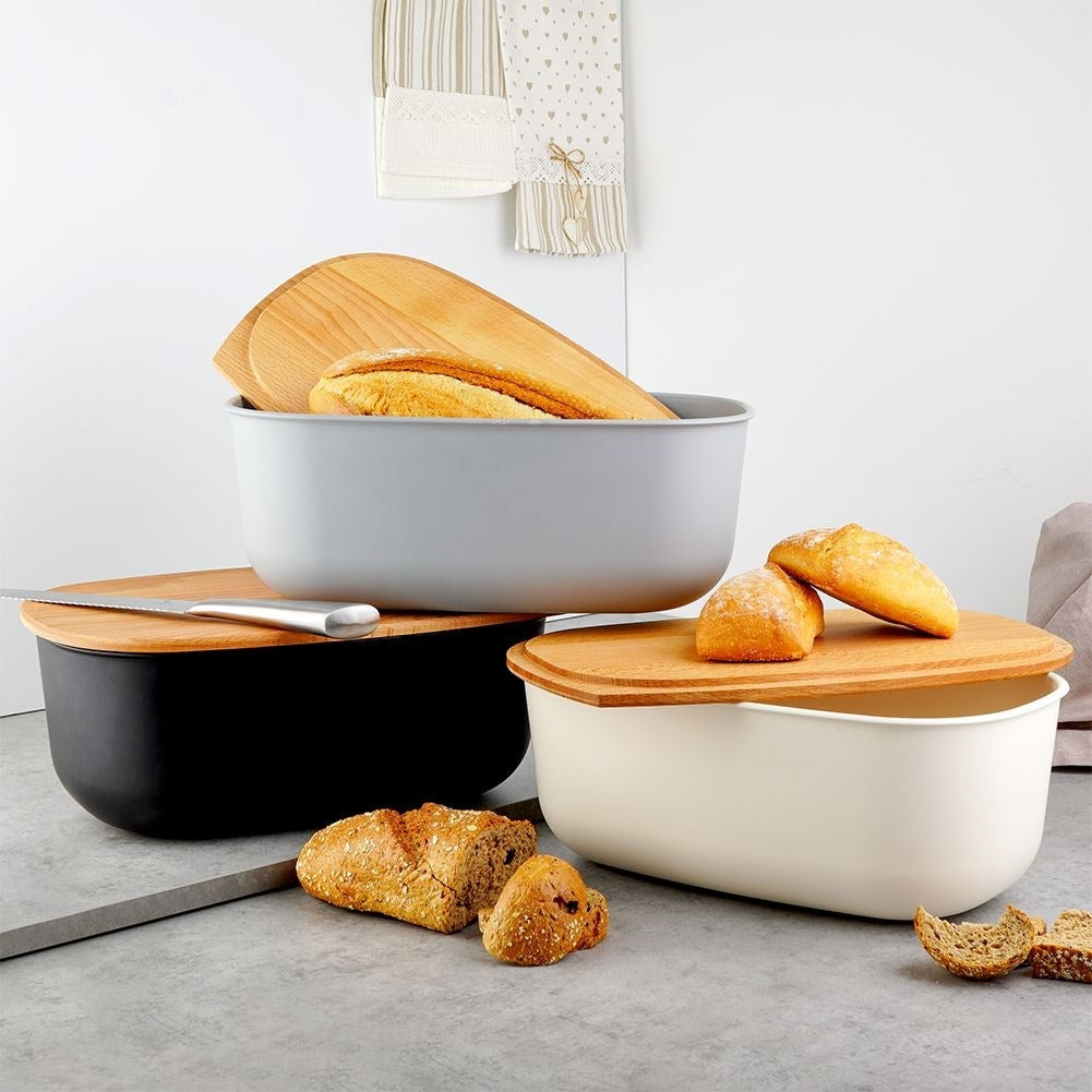 Spacious gray bread tin with a wooden cutting board as a lid