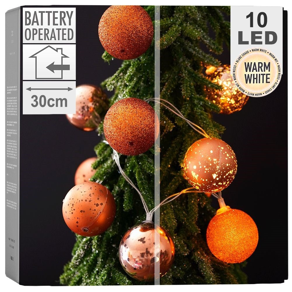 Sparkling copper colored Christmas tree balls with LED lights