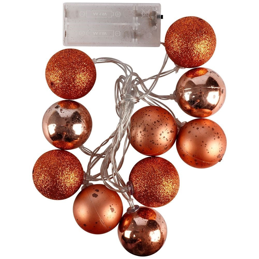 Sparkling copper colored Christmas tree balls with LED lights