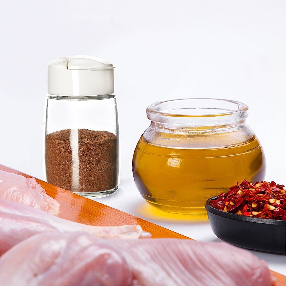Spice container in glass with dosing function and plastic lid