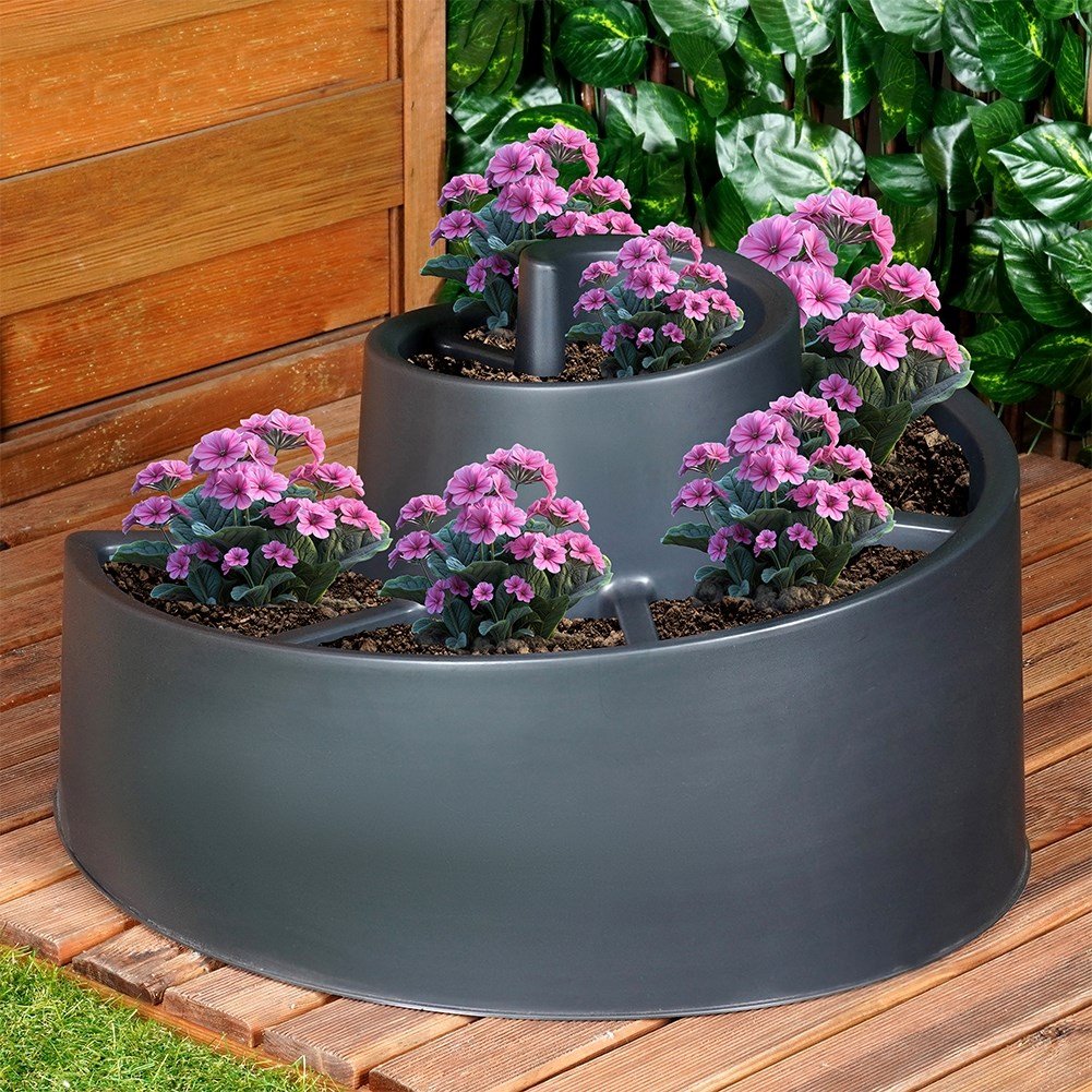Spiral-shaped plant cascade in black plastic for garden