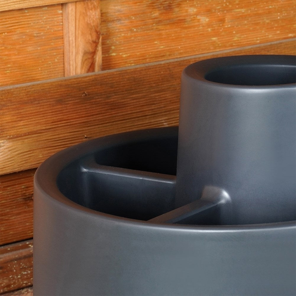 Spiral-shaped plant cascade in black plastic for garden