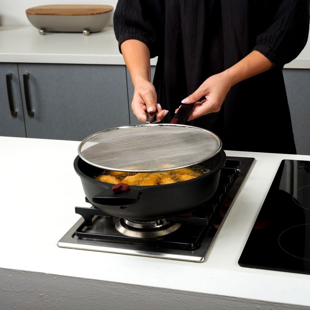 Splash guard with steel strainer and comfortable handle for frying