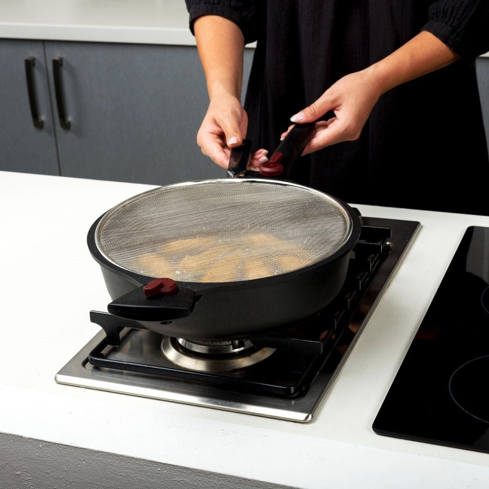 Splash guard with steel strainer and comfortable handle for frying