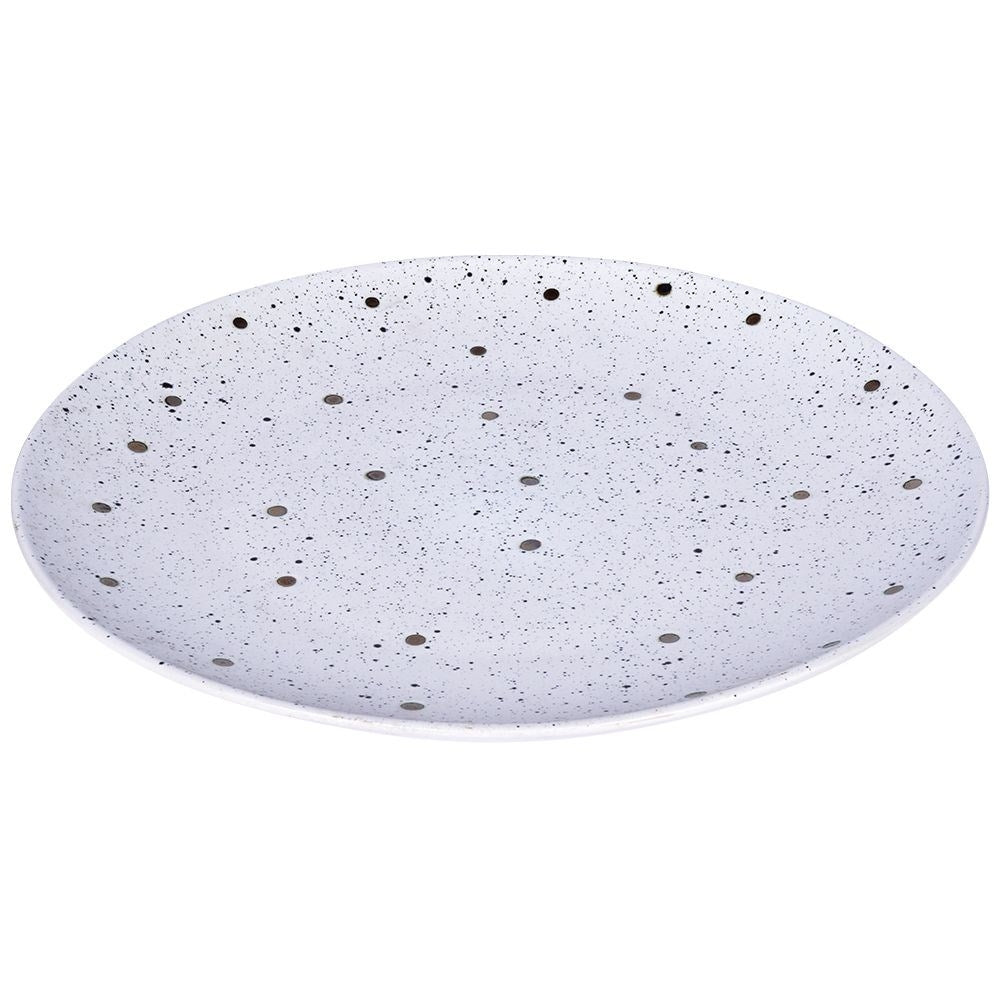 Splash-patterned matt white ceramic plate in black and gold