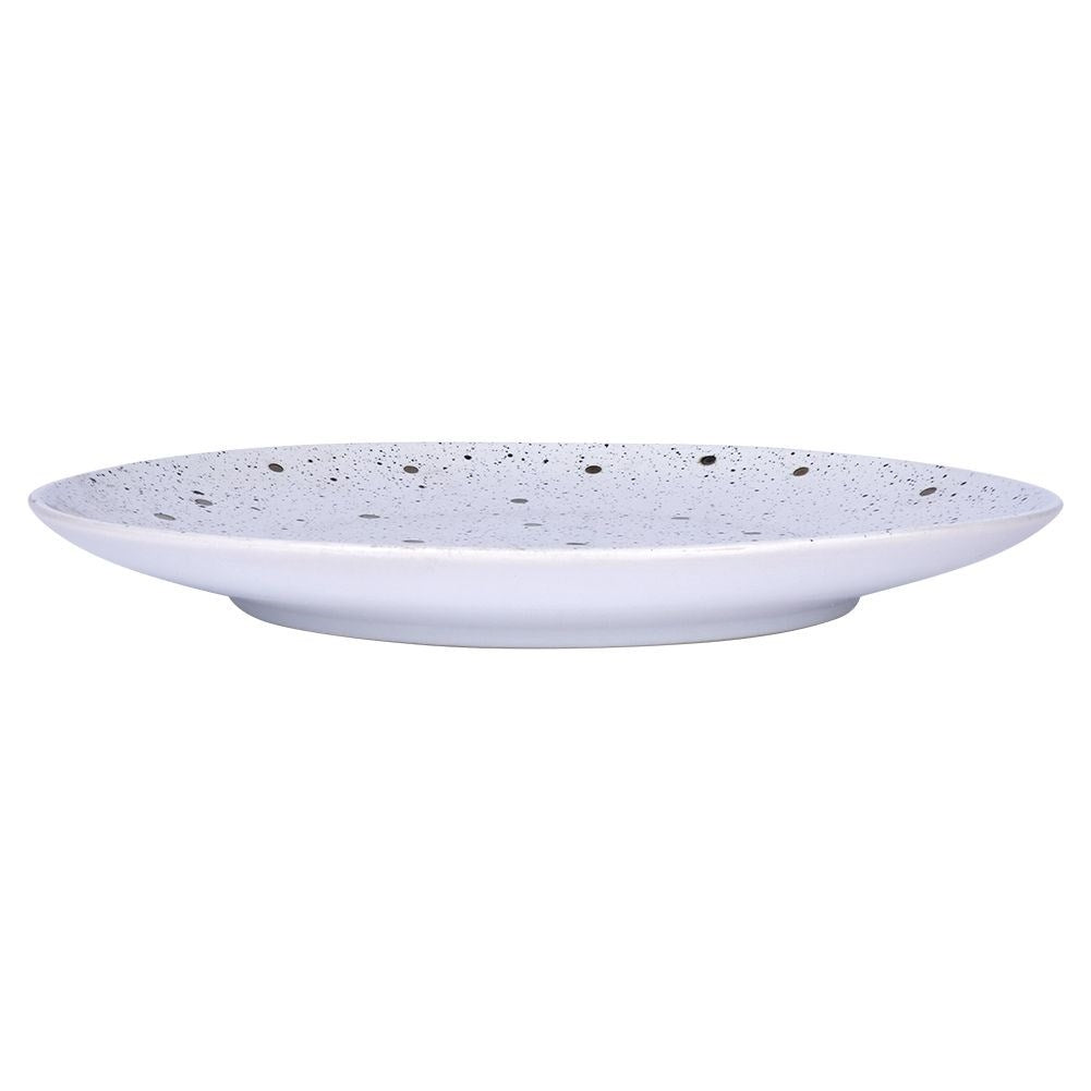 Splash-patterned matt white ceramic plate in black and gold