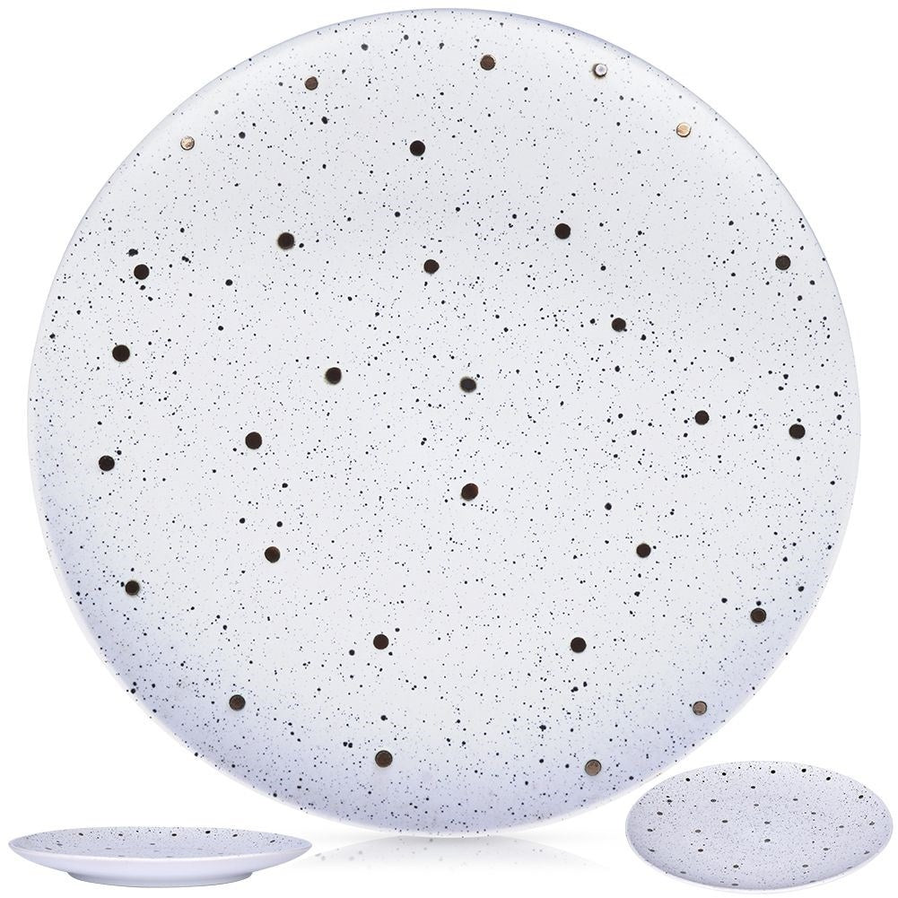 Splash-patterned matt white ceramic plate in black and gold