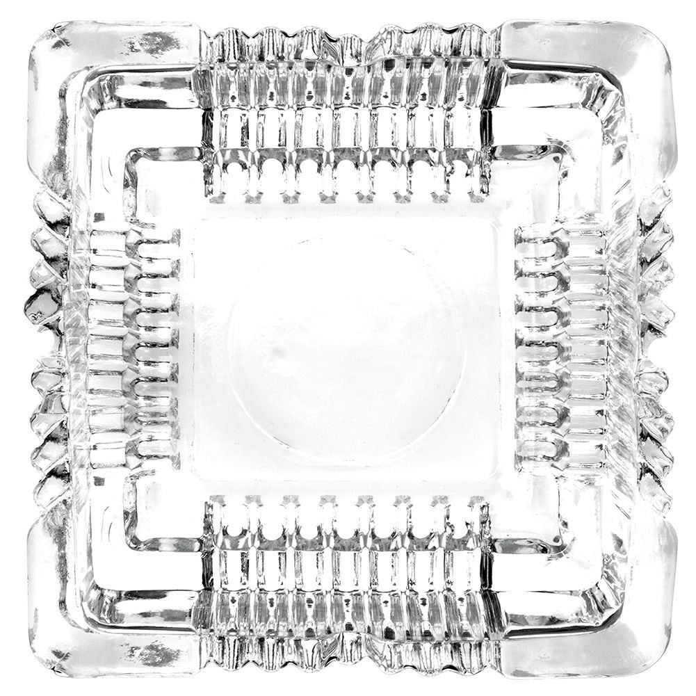 Square crystal-like glass ashtray with four cigarette sockets