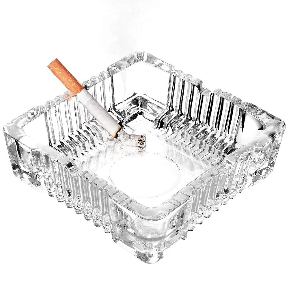 Square crystal-like glass ashtray with four cigarette sockets