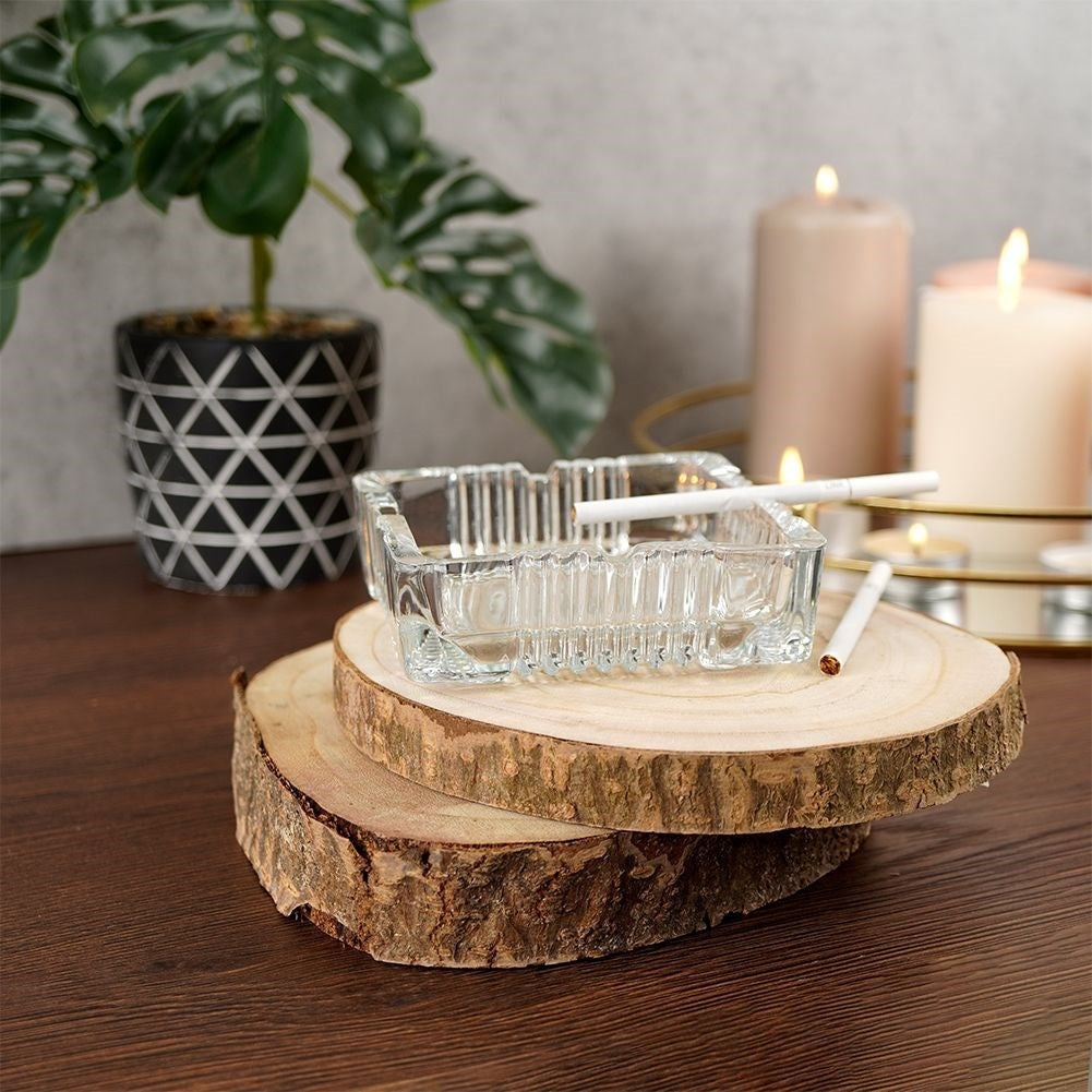 Square crystal-like glass ashtray with four cigarette sockets