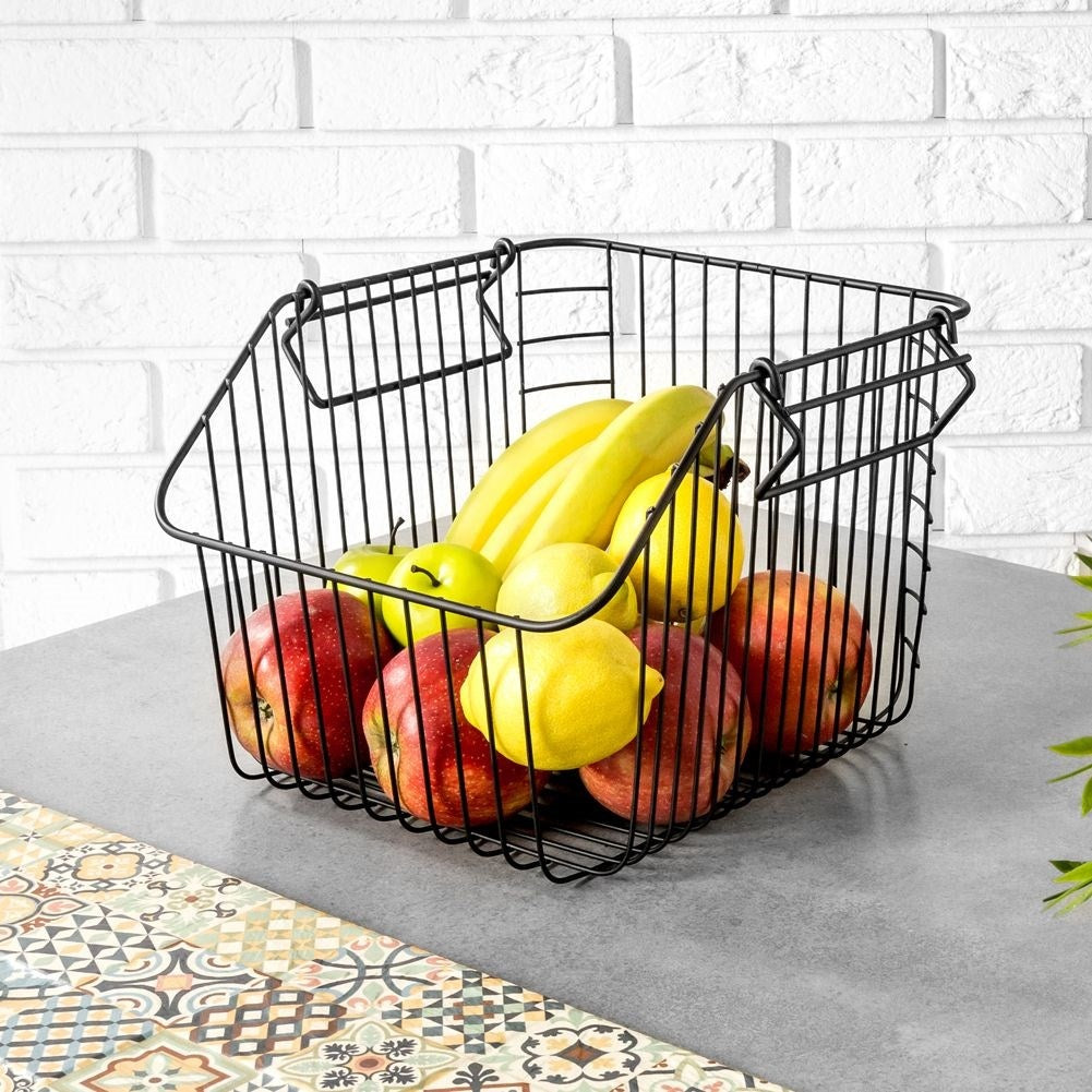 Stackable fruit basket in black metal for kitchen storage