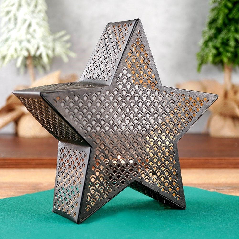 Star-shaped candle holder in gold and black for heat candles