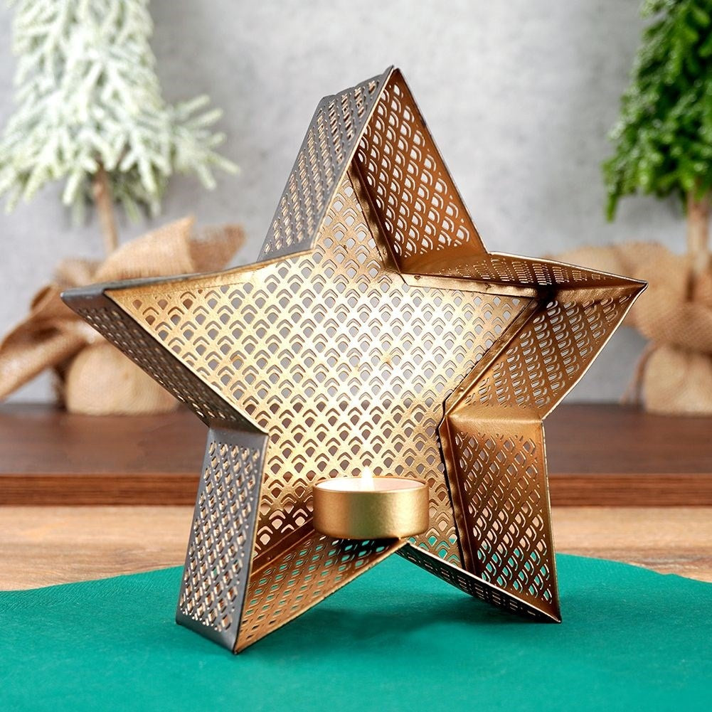 Star-shaped candle holder in gold and black for heat candles