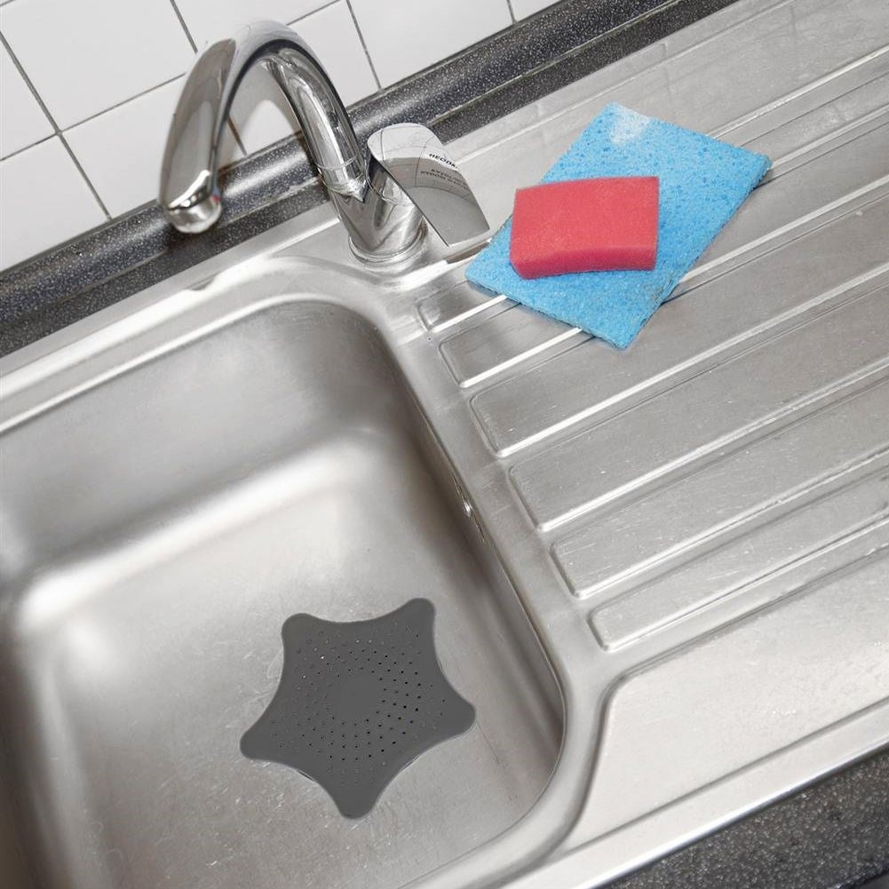 Star-shaped dish strainer with suction cups for easy cleaning