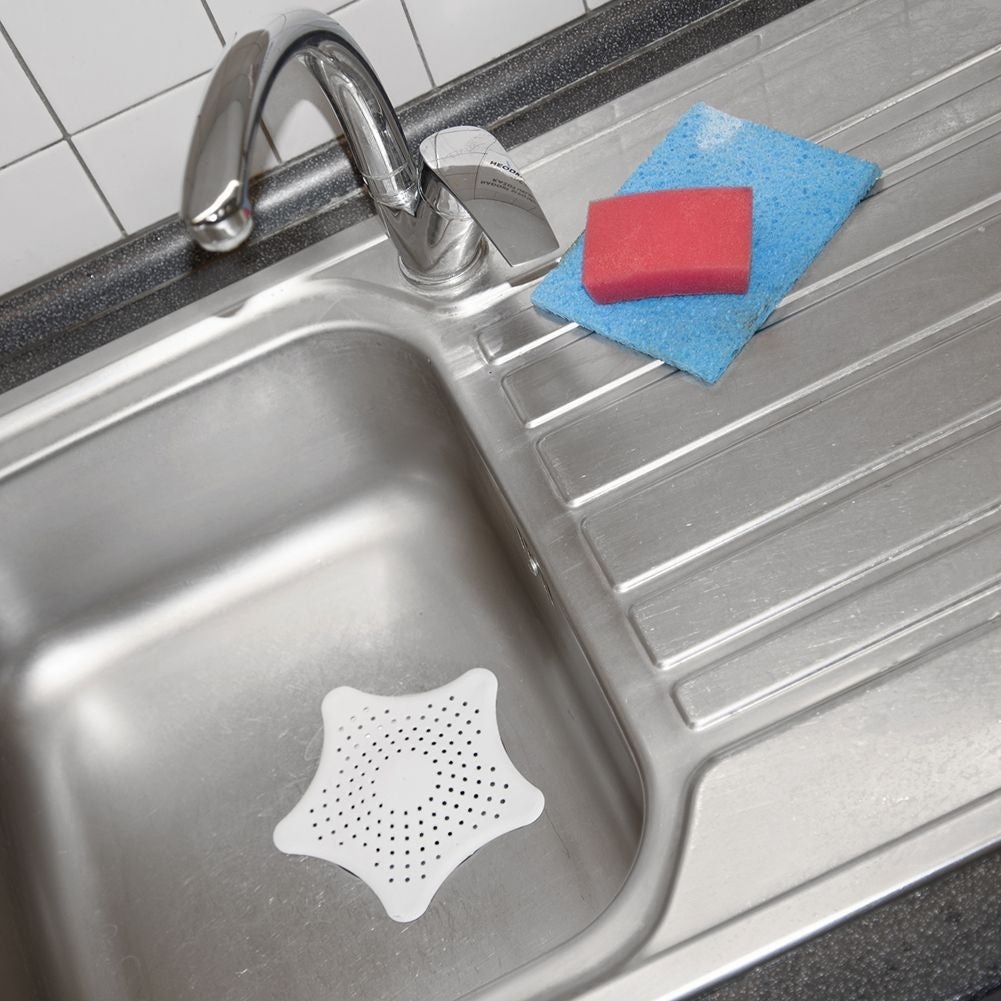 Star-shaped strainer for sinks with suction cups