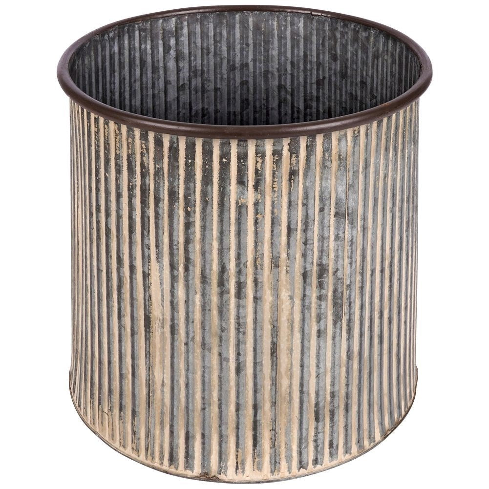 Steel flower pot with grooved surface on a wooden stand