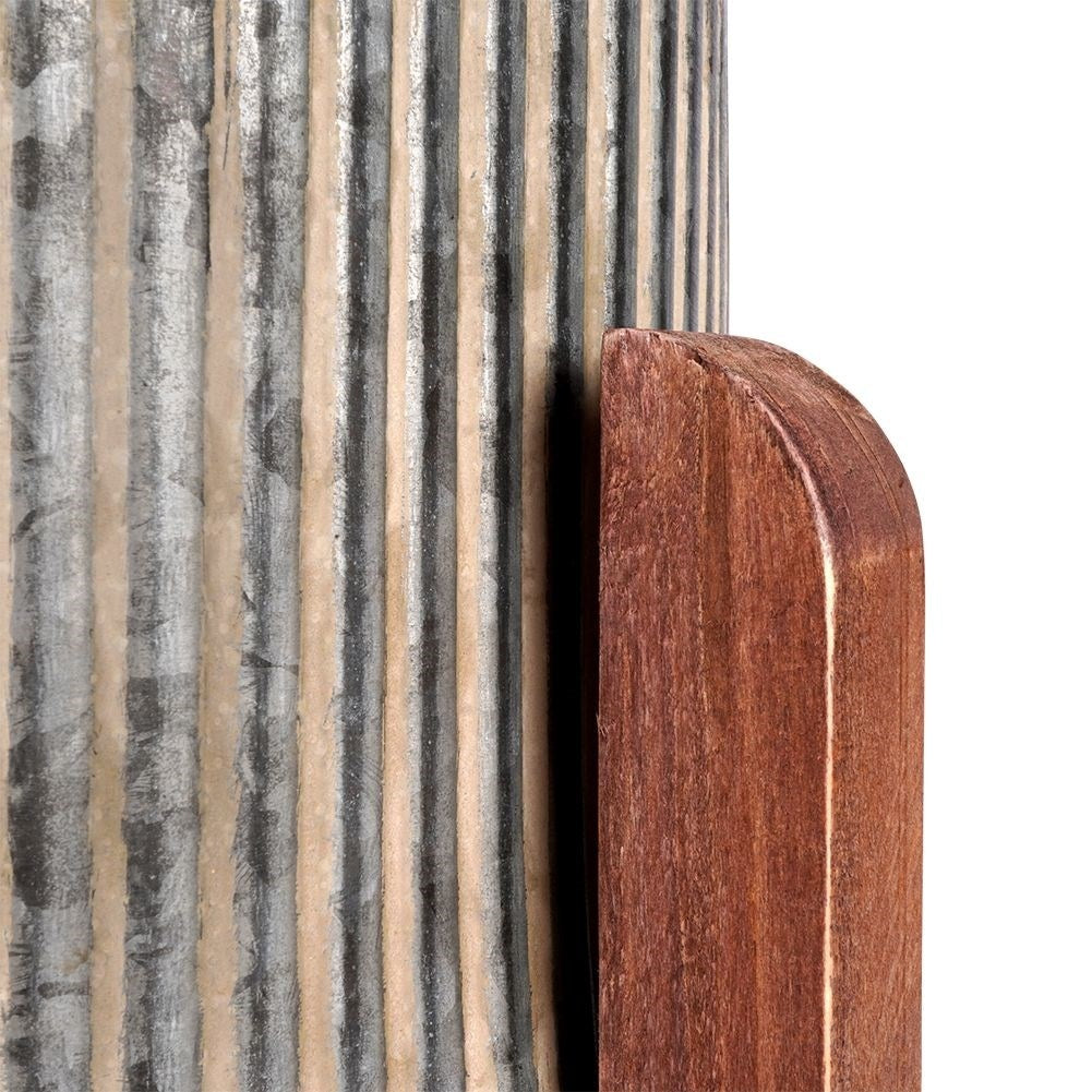 Steel flower pot with grooved surface on a wooden stand