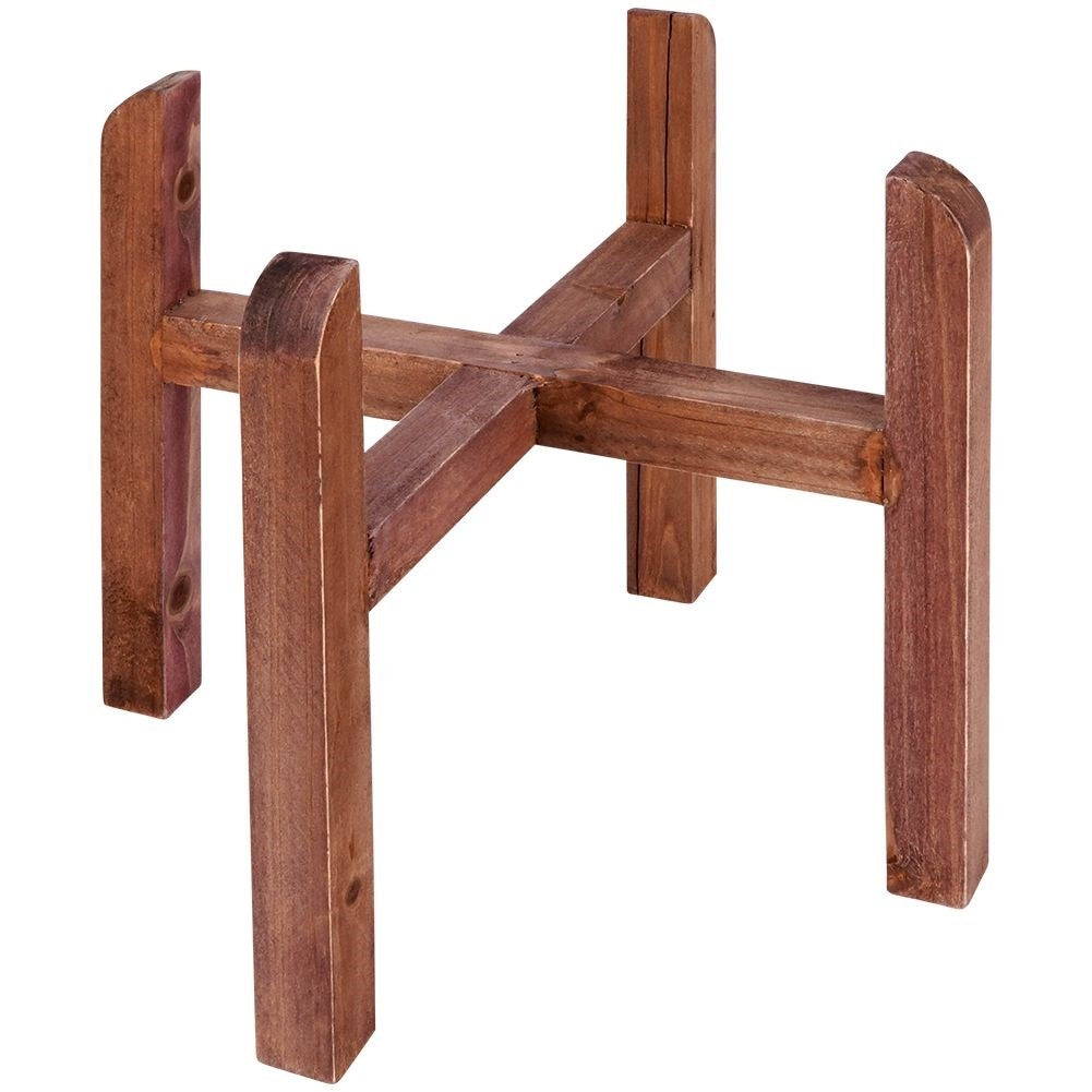 Steel flower pot with grooved surface on a wooden stand