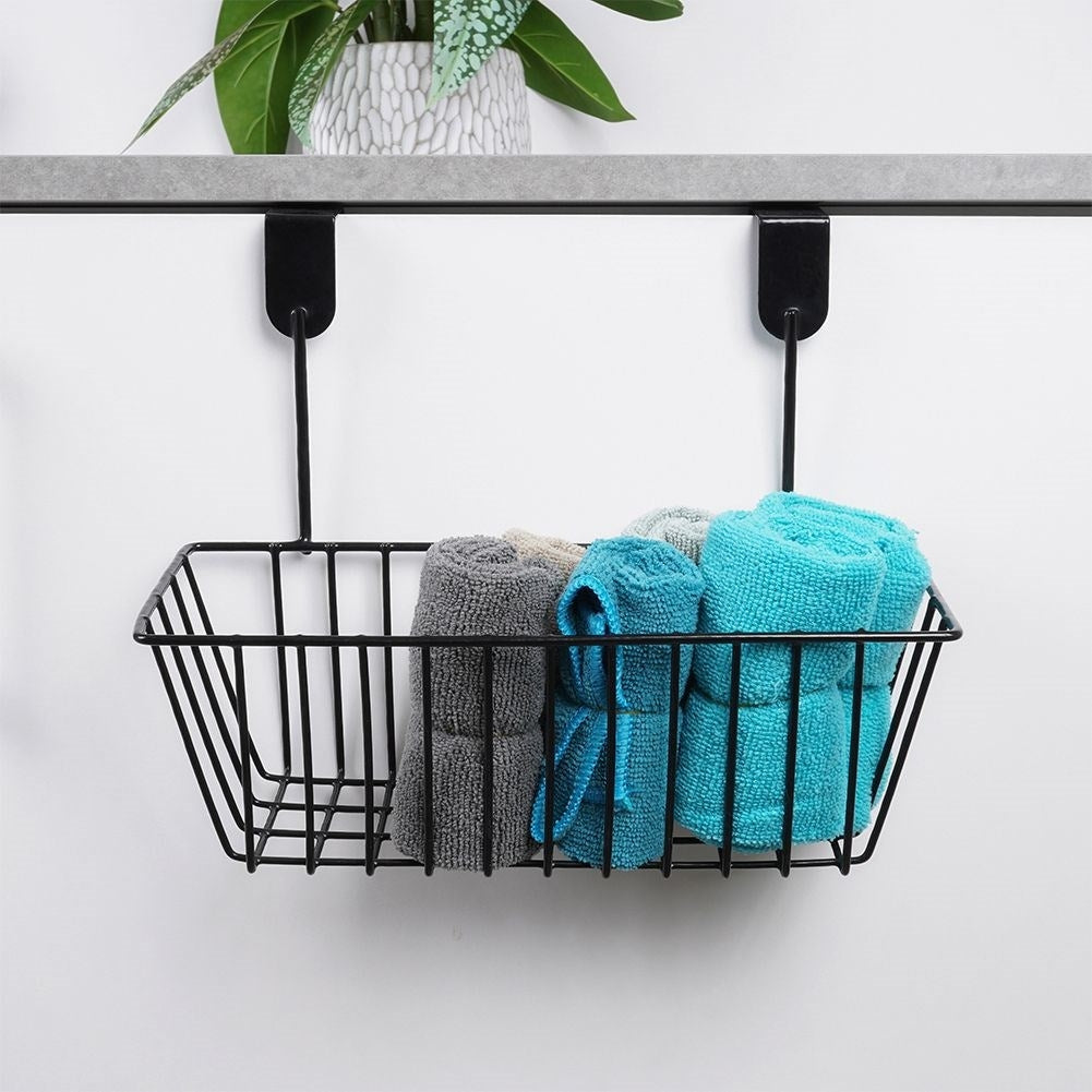 Storage basket for cabinet doors and shower cubicles