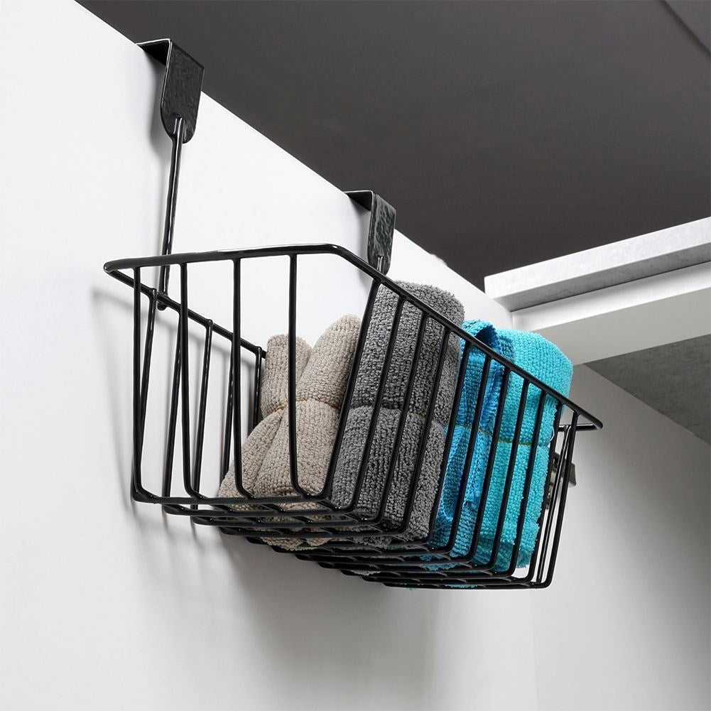 Storage basket for cabinet doors and shower cubicles