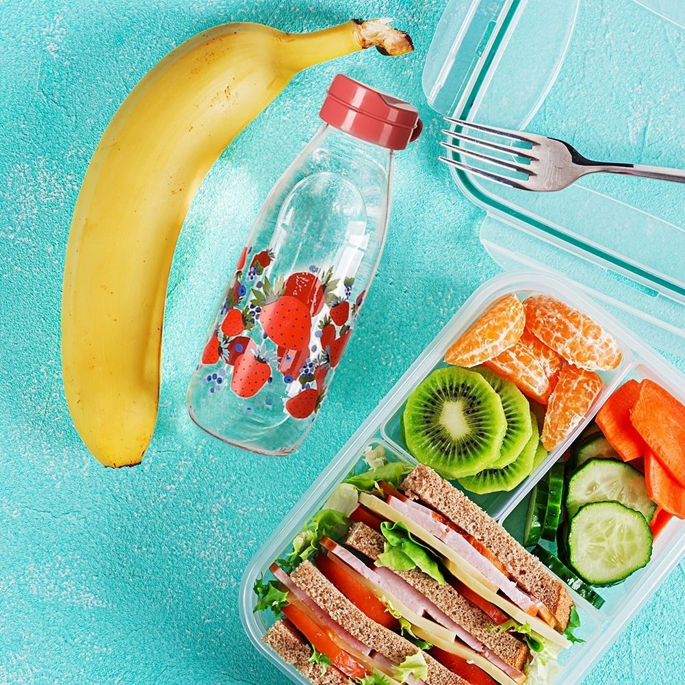 Strawberry motif glass bottle with yellow plastic cap
