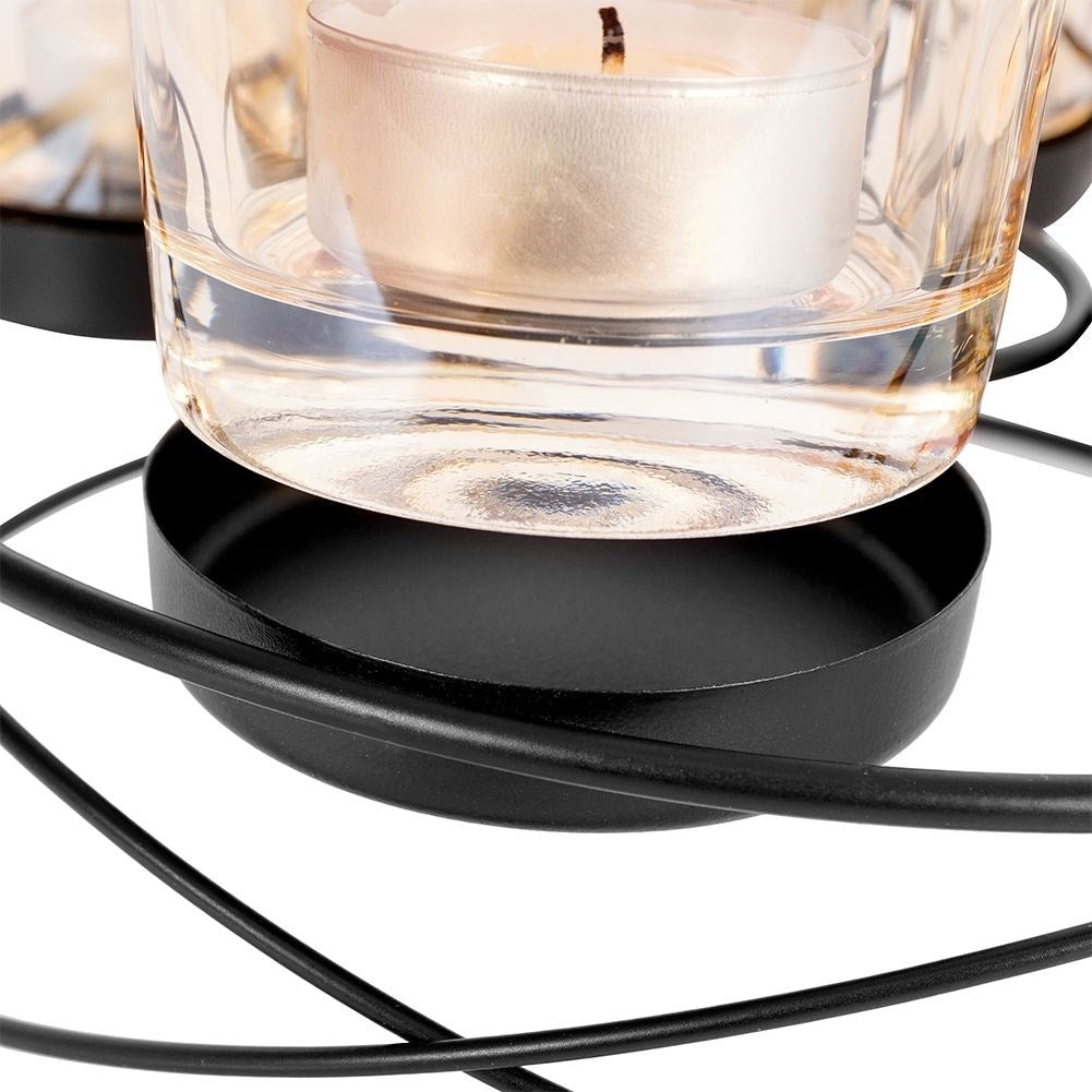 Stylish black candlestick for four tealights with glass insert