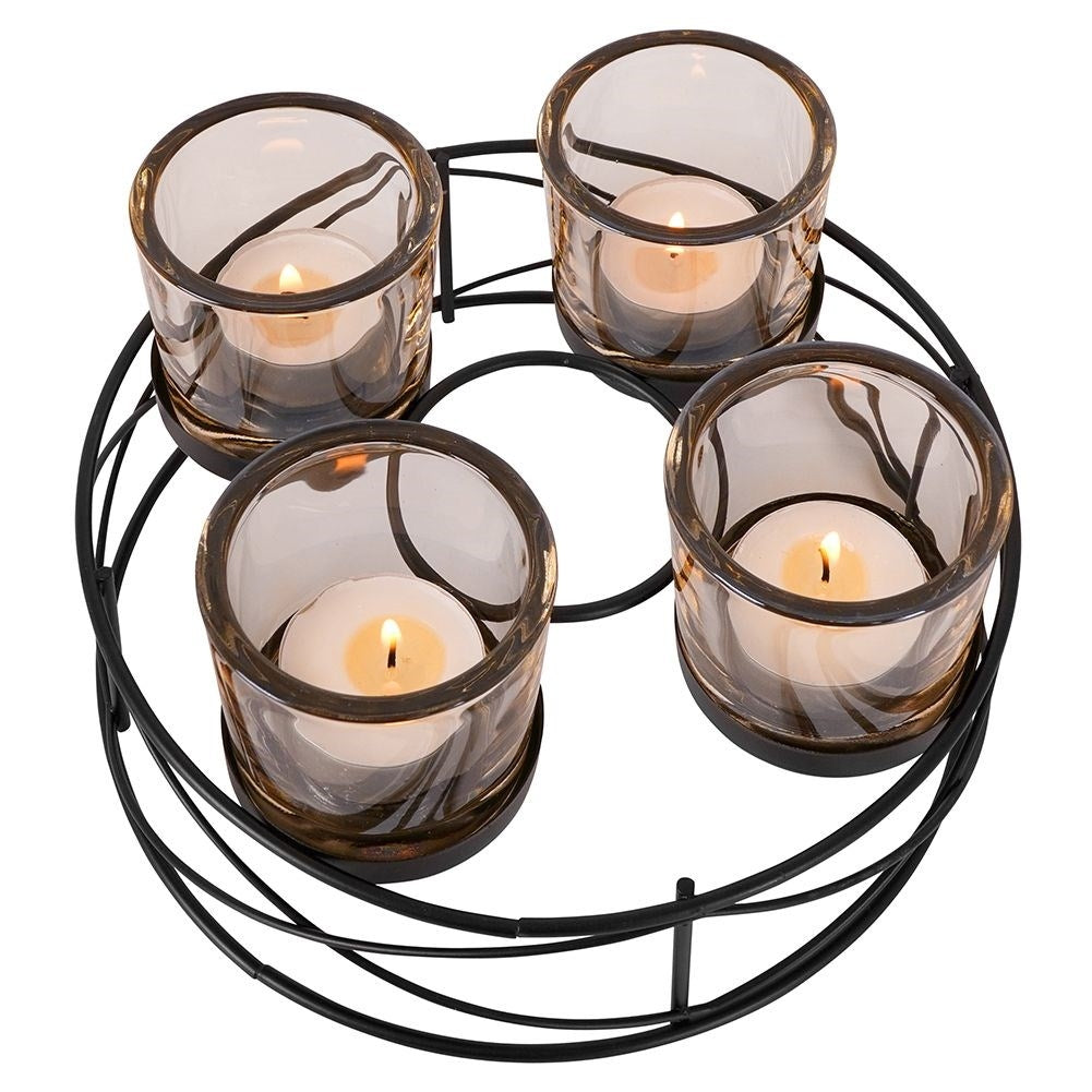 Stylish black candlestick for four tealights with glass insert