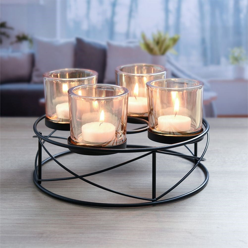 Stylish black candlestick for four tealights with glass insert