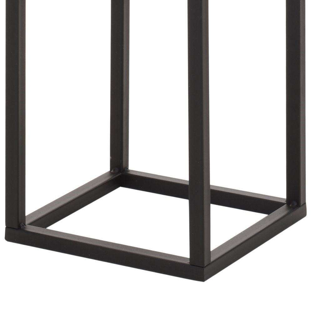 Stylish black metal flower pot on a stand