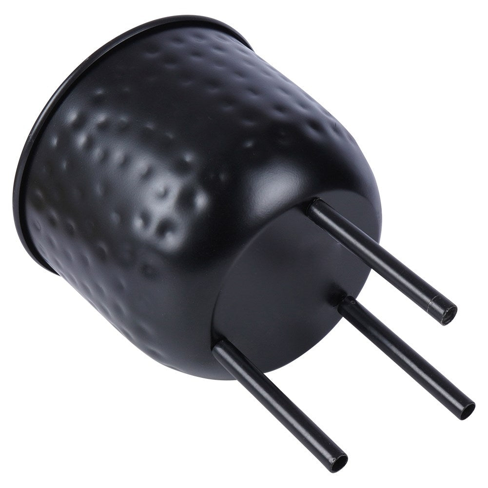 Stylish black metal pot on three legs for plants.
