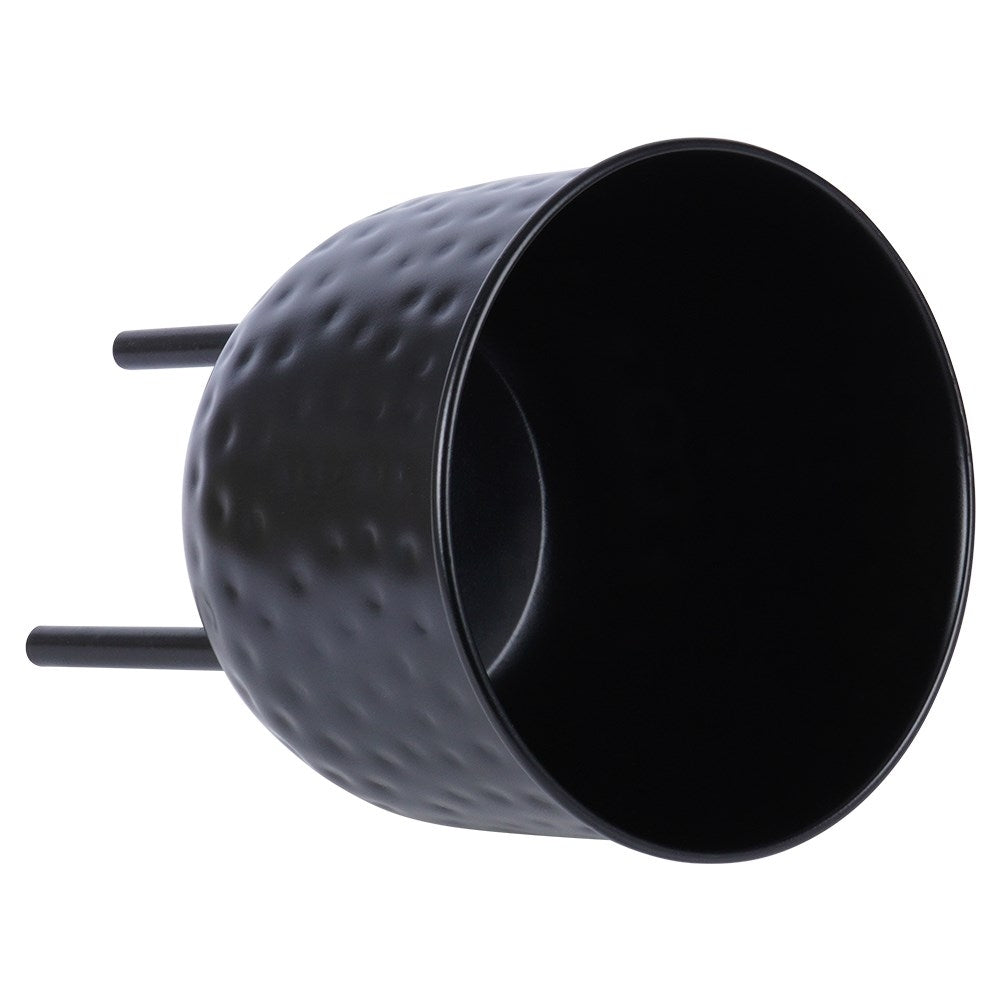 Stylish black metal pot on three legs for plants.