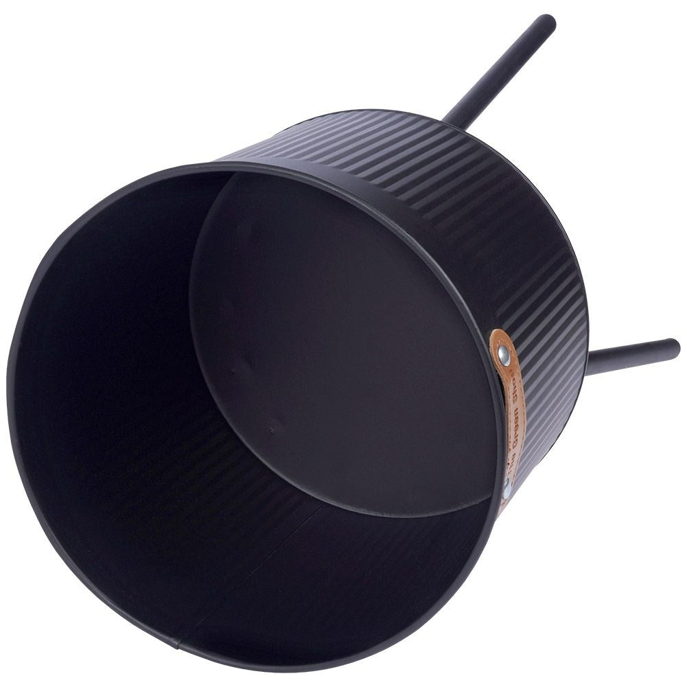 Stylish black metal pot with grooved surface and three legs