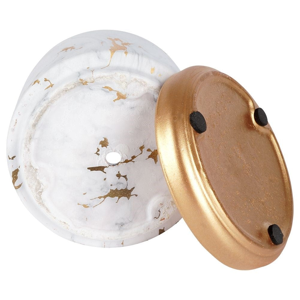 Stylish flower pot in a marble look with golden details