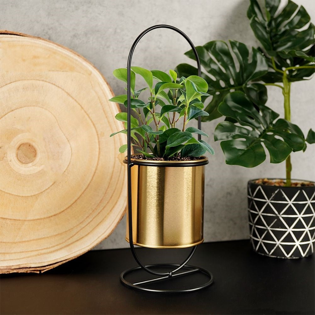 Stylish flowerpot with stand in black and gold