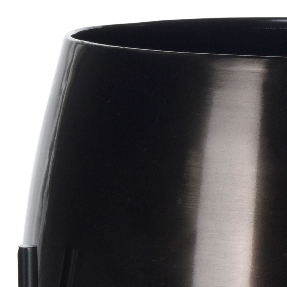 Stylish graphite colored metal pot on legs for plants