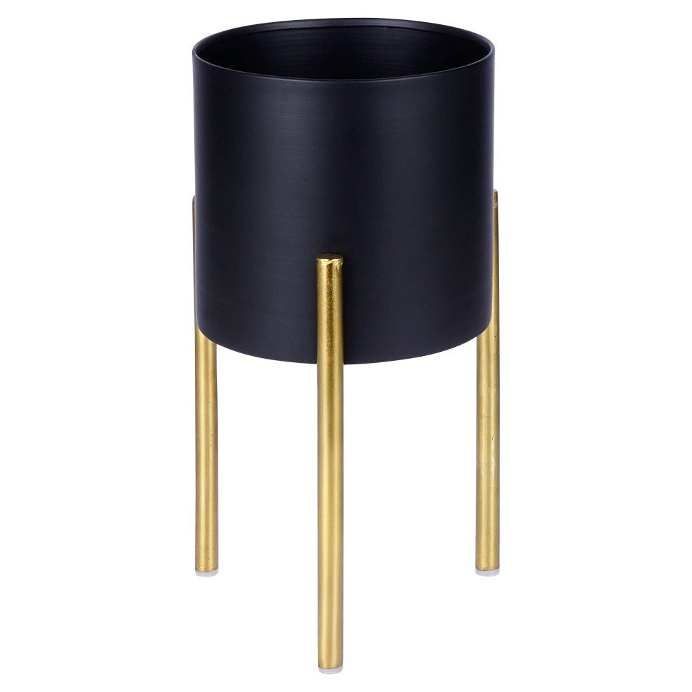 Stylish metal pot on stand in black and gold for plants